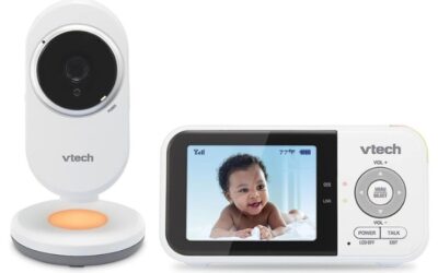 A VTech baby monitor with a camera unit and a handheld display screen showing a baby. The image represents the question, "Can I Watch My VTech Baby Monitor on My Phone?" by showcasing the traditional monitor setup.