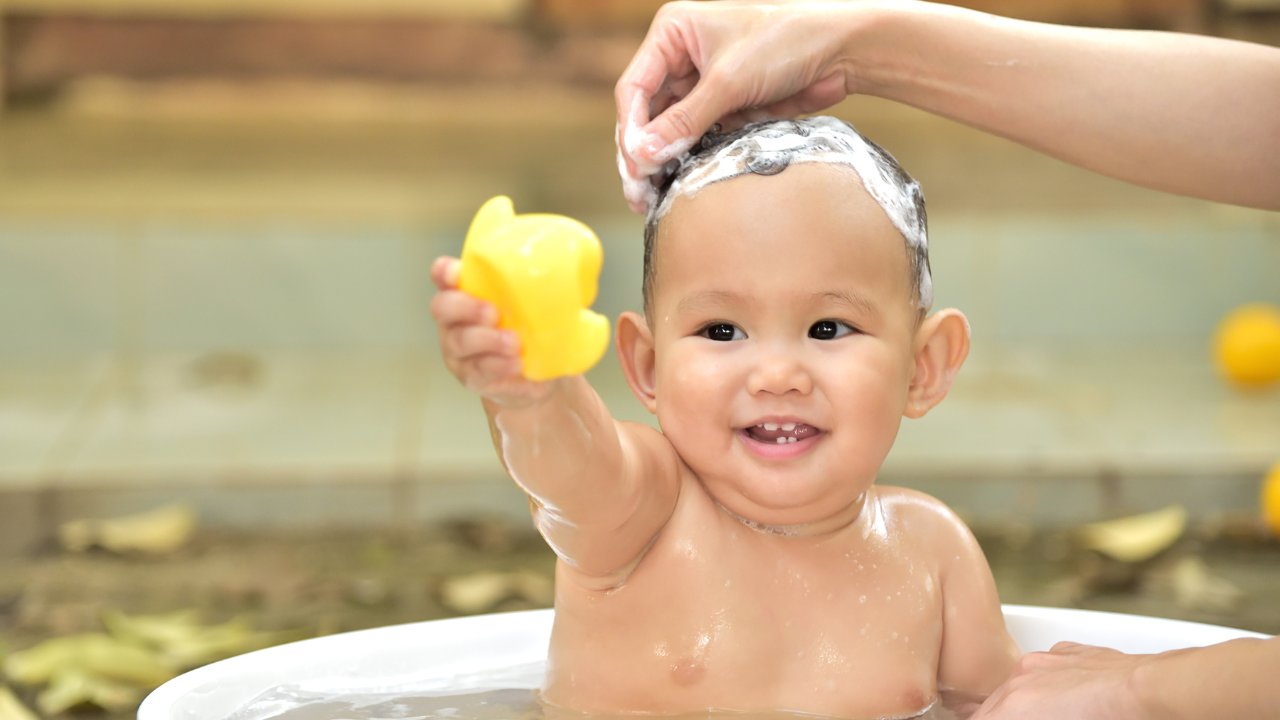 A selection of baby shampoos displayed on a store shelf, labeled for promoting hair growth and thickness. | best baby shampoo for hair growth